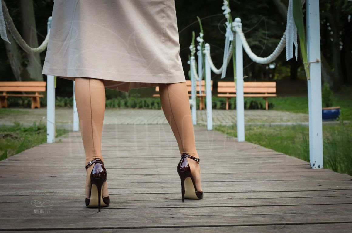 Mrs NyloNova wearing open front na-kd skirt, old vintage nylon ff stockings and Only Maker high heeled sandals.