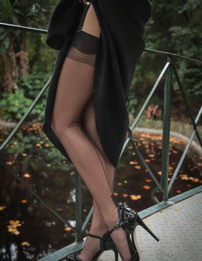 Mrs NyloNova wearing long black dress, Gino Rossi high heels and sheer black seamed Cervin nylon stockings.