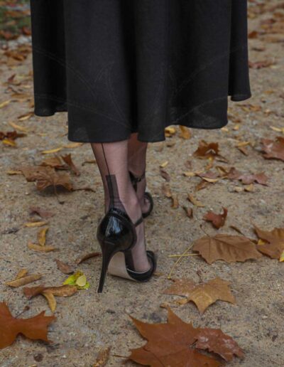 Mrs NyloNova wearing long black dress, Gino Rossi high heels and sheer black seamed Cervin nylon stockings.